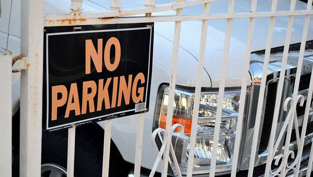 No Parking sign posted outside a house