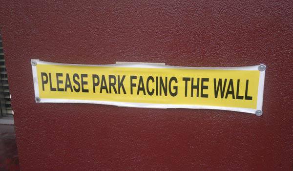 "Face the wall" parking sign