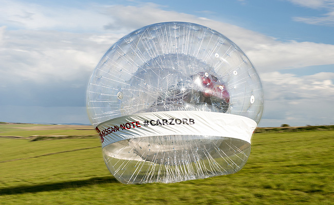 TopGear.com.ph Philippine Car News - Nissan rolls Note MPV downhill in world’s largest Zorb