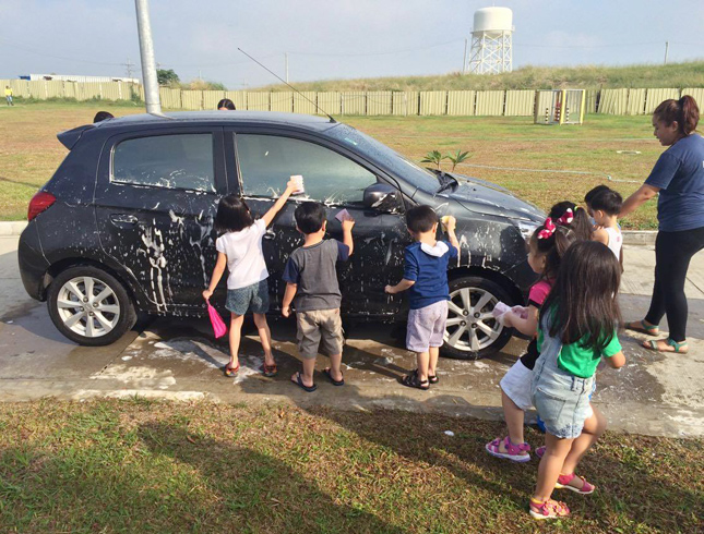 Children washing a car