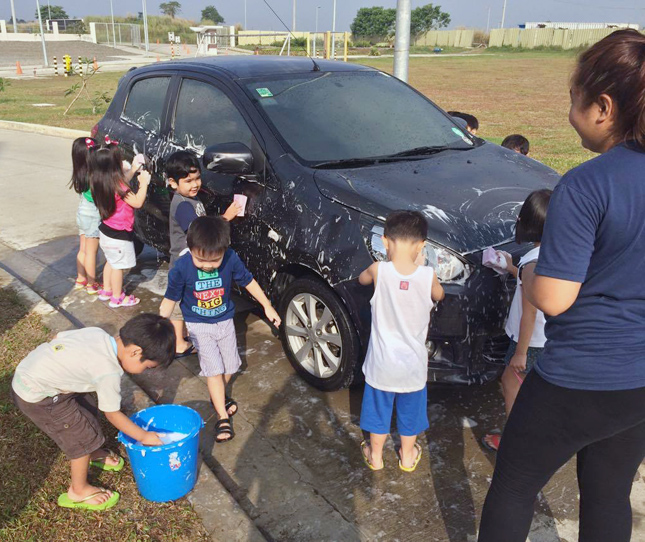 Children washing a car